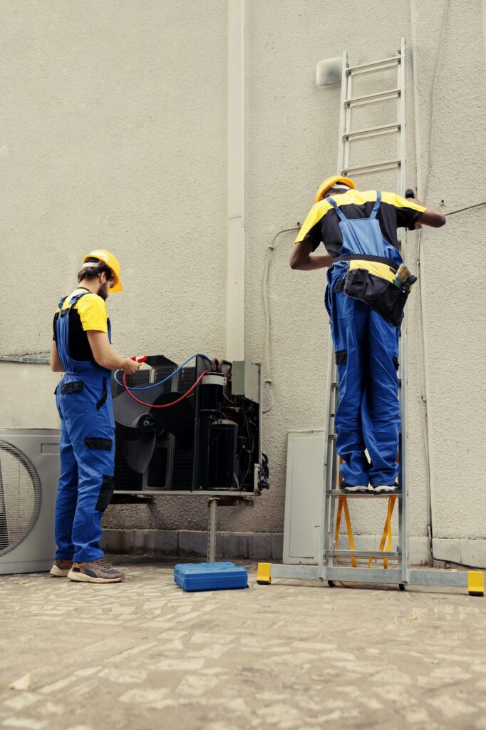 Coworkers doing hvac system checkup